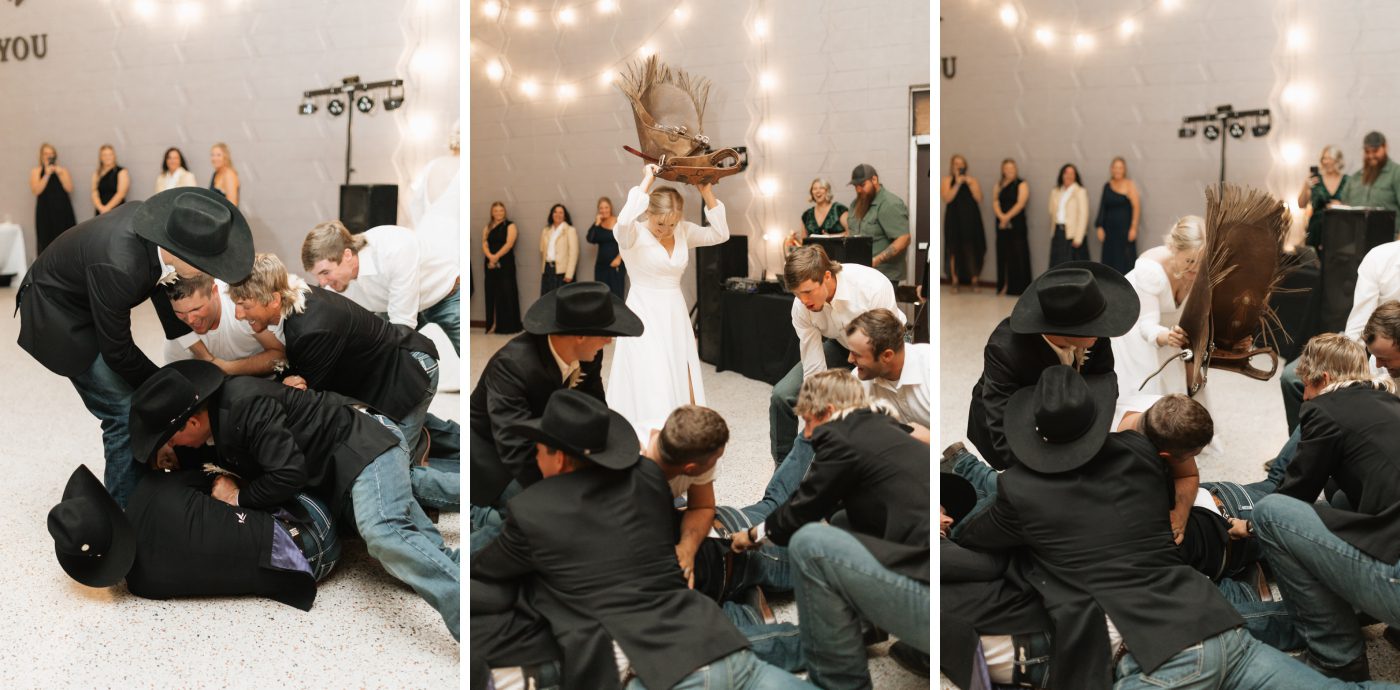 Groomsmen tackle the groom and a bride places a saddle on him