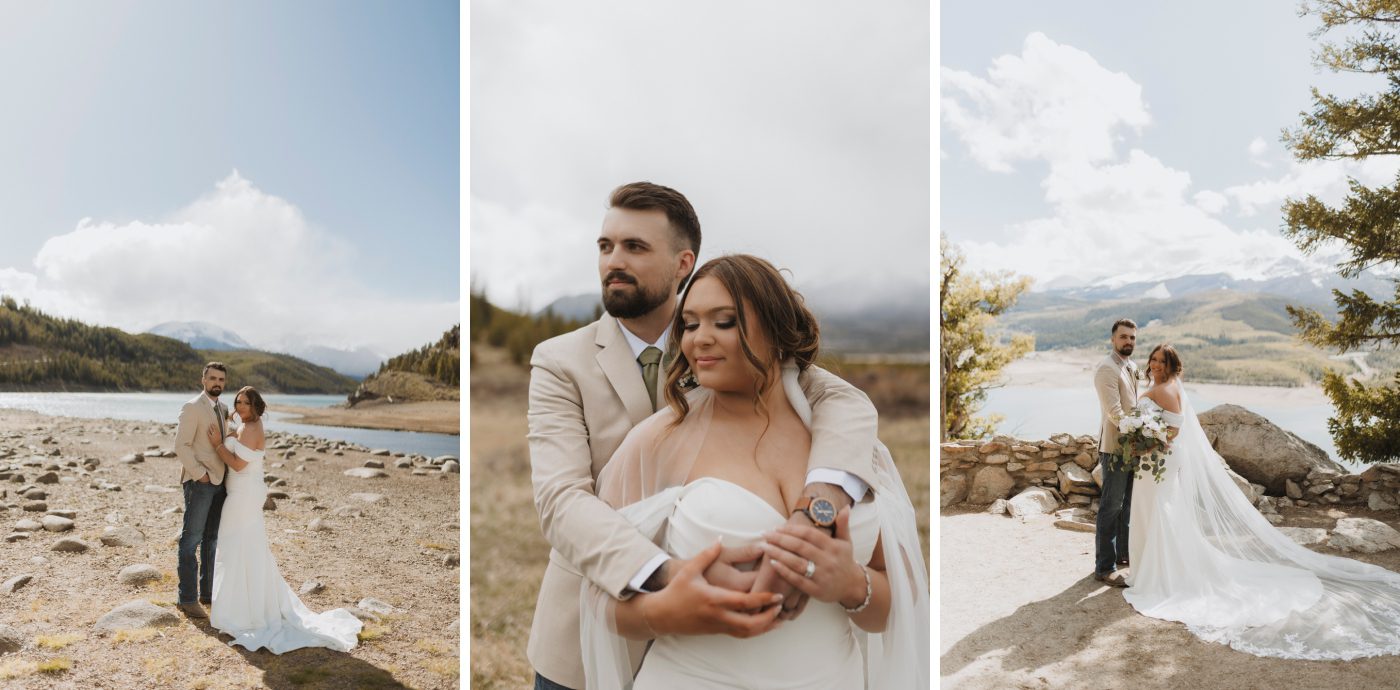A bride and groom stand on an outlook overlooking a lake with the Rocky mountains partially obscured by fog behind them
